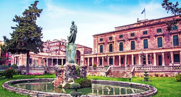 photo of beautiful landscape with Statue of Frederick Adam in front of the Royal palace of St. Michael and St. George (Museum of asian art) in Corfu, Greece. Amazing places. Popular tourist atraction.,Corfu Greece.