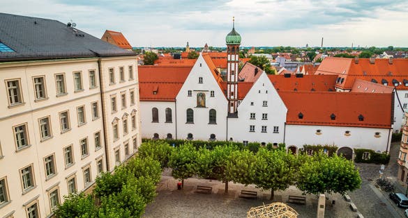 photo of view of View over Elias-Holl-Platz square from the town hall of Augsburg, in background is gothic Monastery of the Franciscan Sisters, Bavaria, Germany