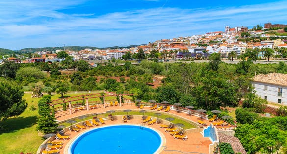 View of Silves town buildings and pool of luxury hotel, Algarve region, Portugal