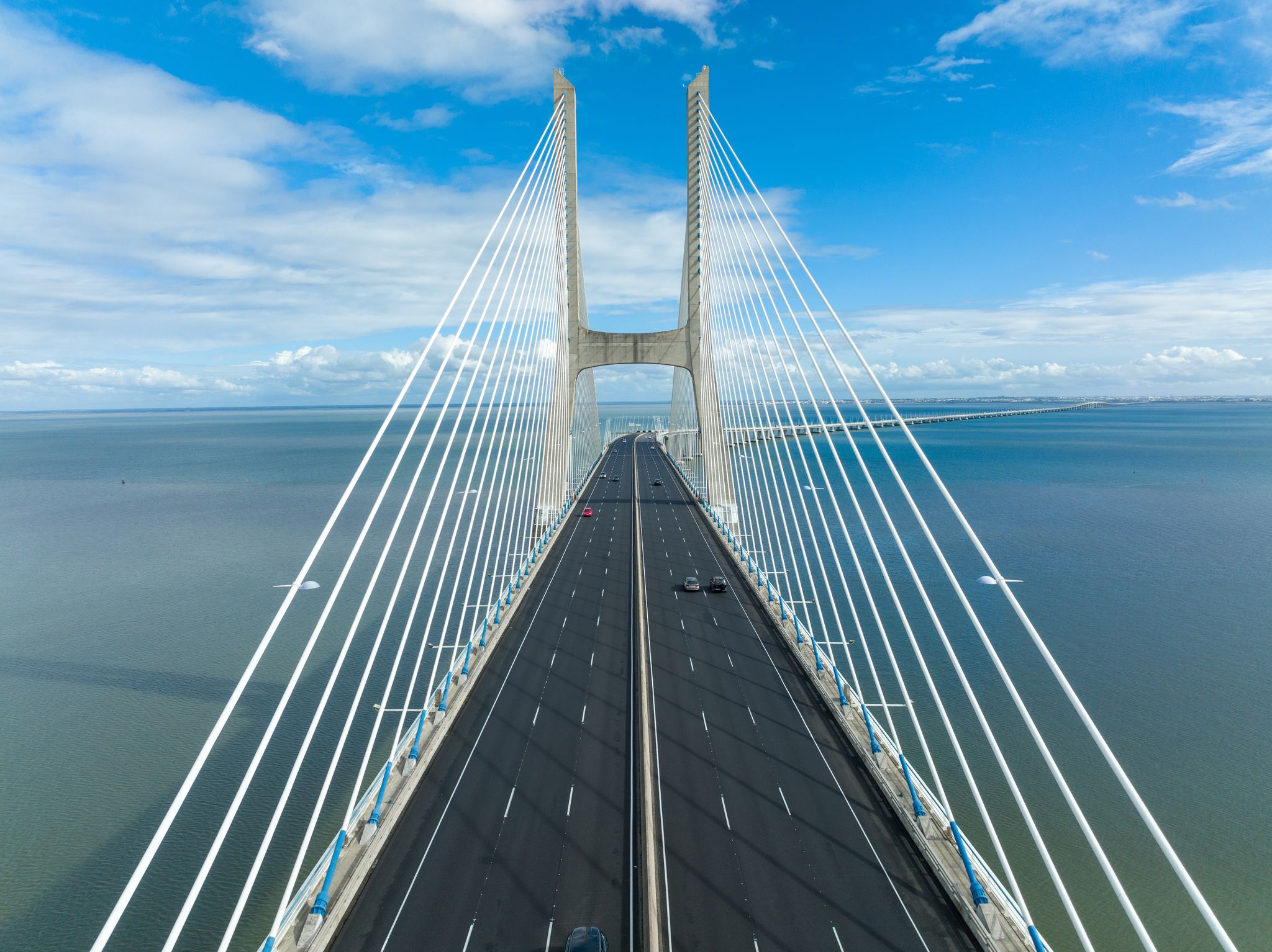 Photo of Vasco Da Gama Bridge in Lisbon, Portugal over the Tagus River. Drone Point of View .