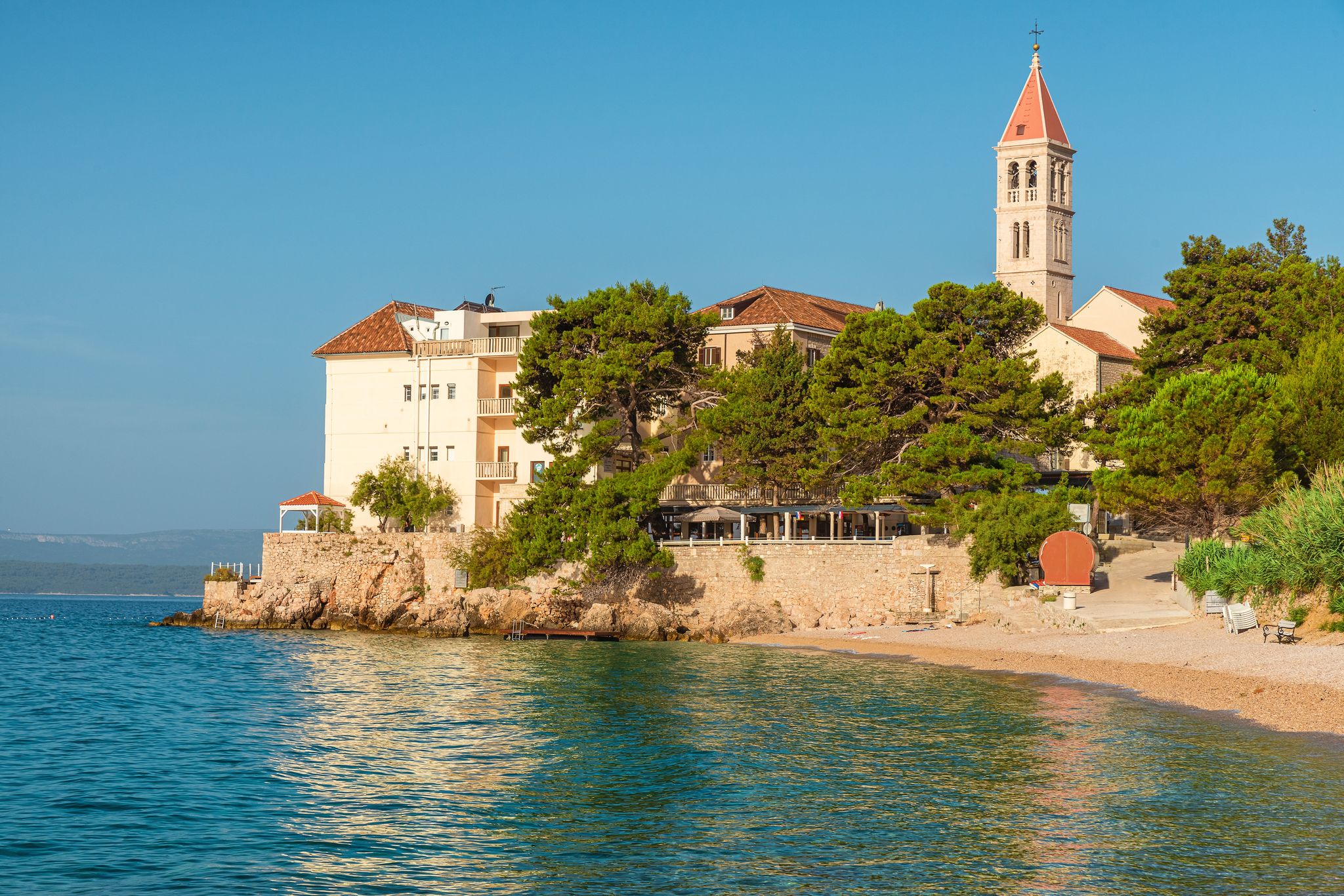 Photo of Dubrovnik Dominikanski Samostan (Dominican Monastery, 1225) and the orange-tiled roofs of Old Town. Dubrovnik, Croatia.