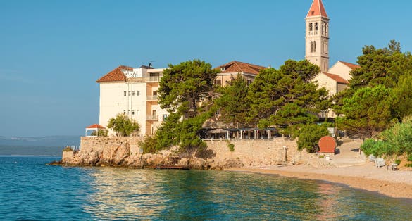 Photo of Dubrovnik Dominikanski Samostan (Dominican Monastery, 1225) and the orange-tiled roofs of Old Town. Dubrovnik, Croatia.