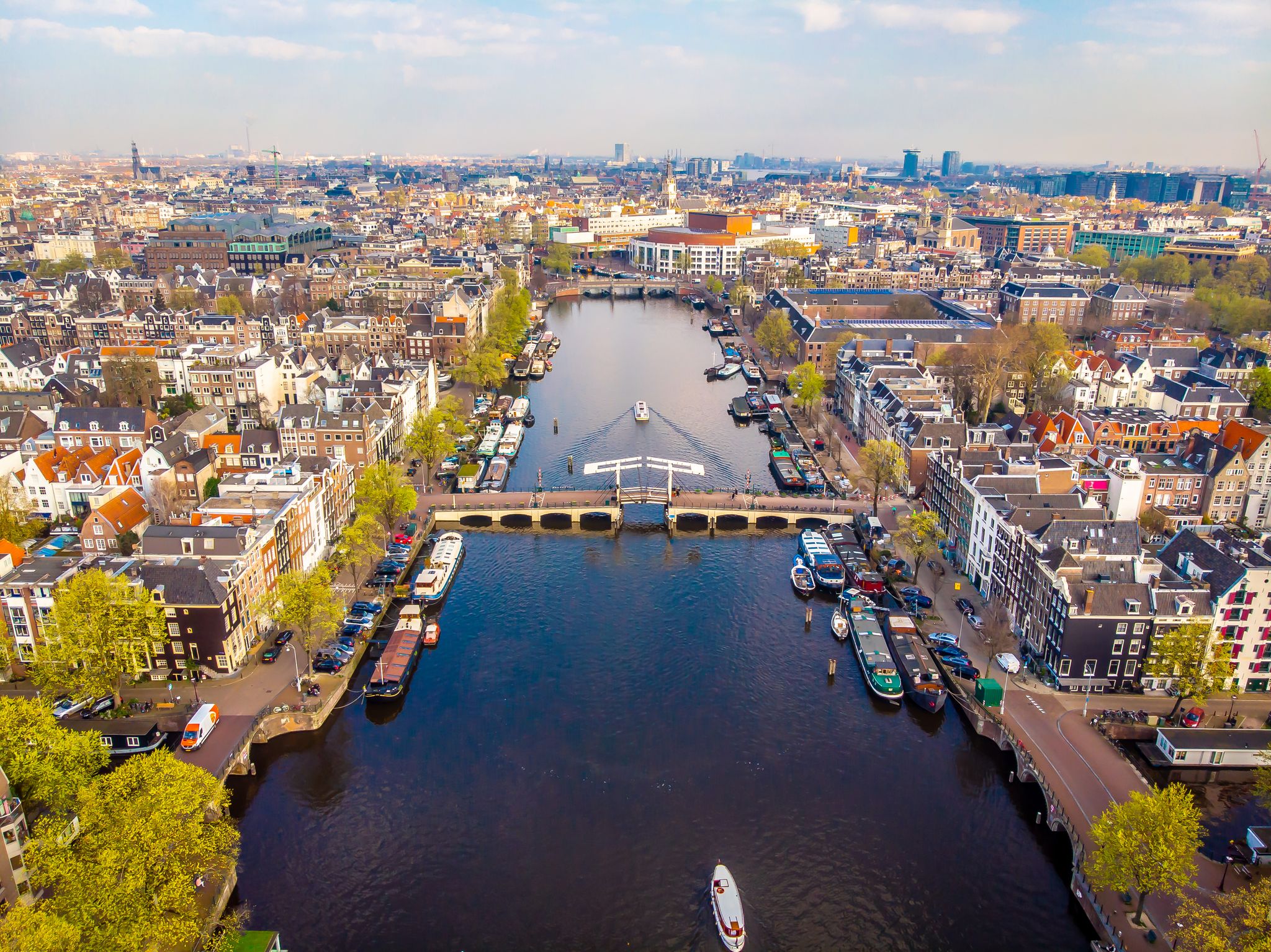 photo of Amsterdam city canal aerial view of Magere Brug or Skinny Bridge in the Netherlands.