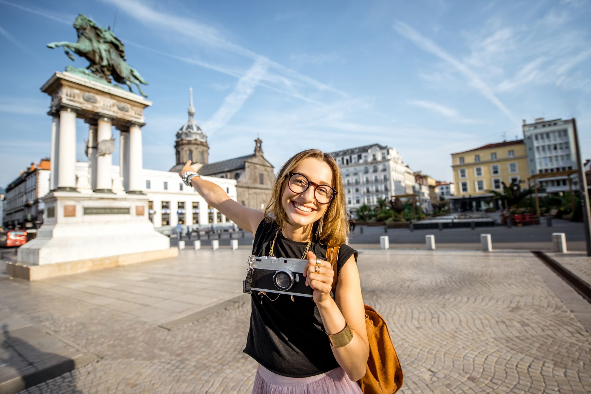 photo of portrait of a young woman tourist on the Place de Jaude in Clermont-Ferrand, France.