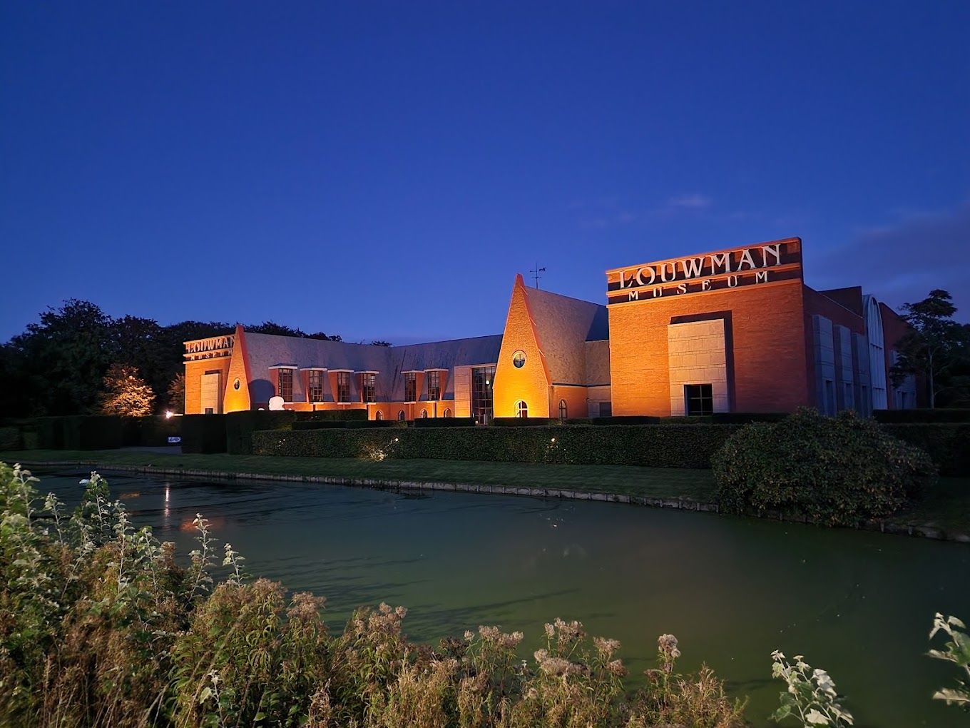 photo of Louwman Museum at night in The Hague, the Netherlands.