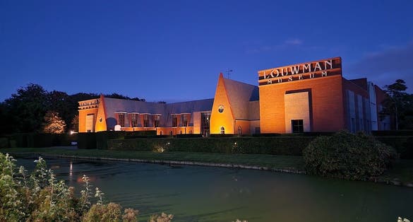 photo of Louwman Museum at night in The Hague, the Netherlands.