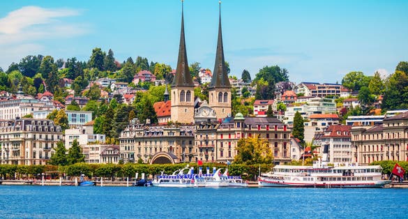 photo of Lake Lucerne and City Skyline with Church of St. Leodegar is a Roman Catholic church in the city of Lucerne, Switzerland.