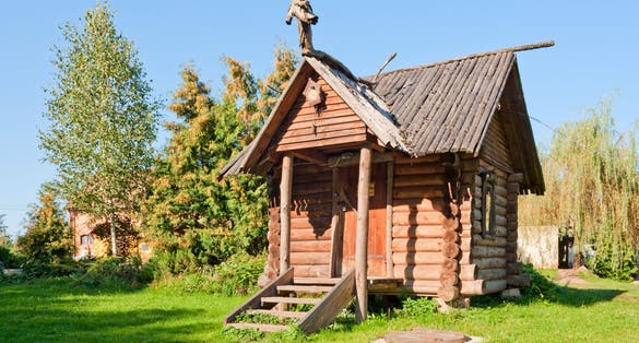 Photo of Wooden hut in Dudutki estate museum, Belarus.