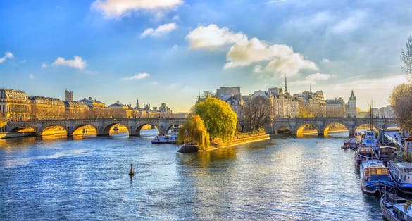 photo of Pont Neuf and river Seine waters at beautiful morning in Paris, France.