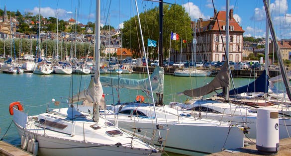 Landscape view on the harbour with beautiful yachts and buildings during the morning light in Deauvillle village in France