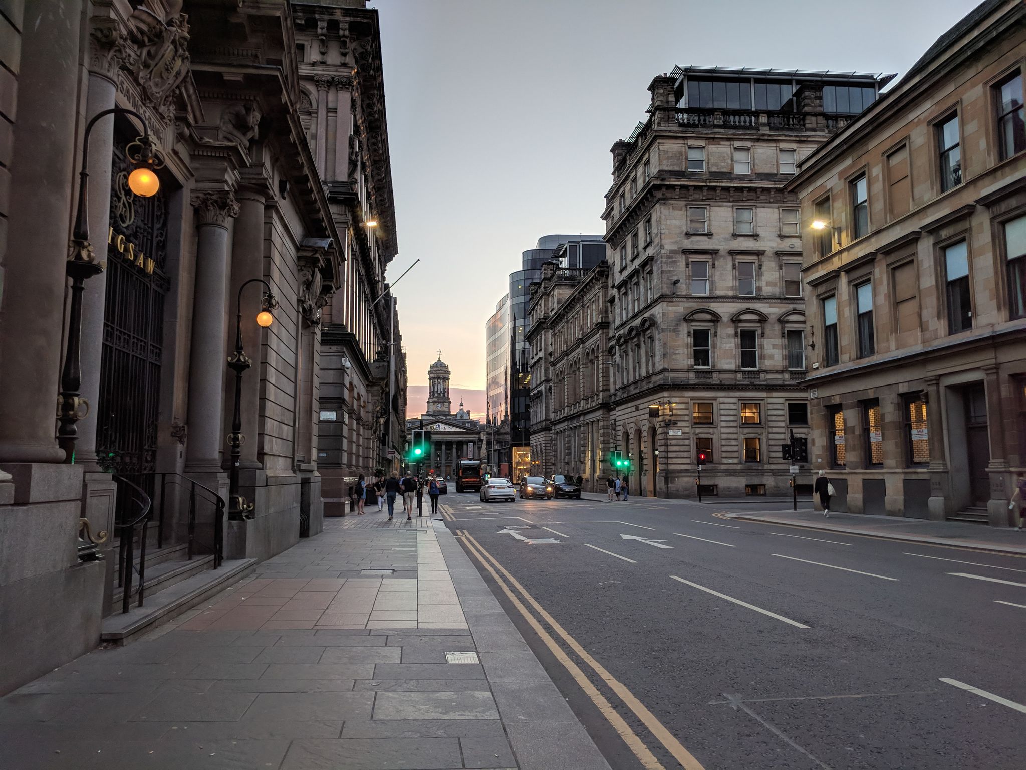City view and George Square at the end of the street in Glasgow, Scotland.