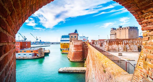 View of the landmark Fortezza Vecchia, an old fortress with a tower located in Livorno, a port city on the Ligurian Sea in Tuscany, Italy.