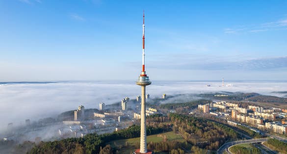photo of aerial beautiful spring morning fog view of vilnius tv tower Lithuania.