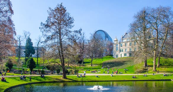 Photo of building of the European parliament is one of the most spectacular buildings in brussels and adjacent park is popular place to relax, Belgium.