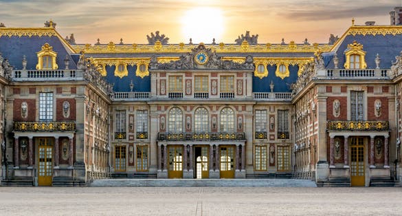Photo of Versailles palace outside Paris at sunset, France.