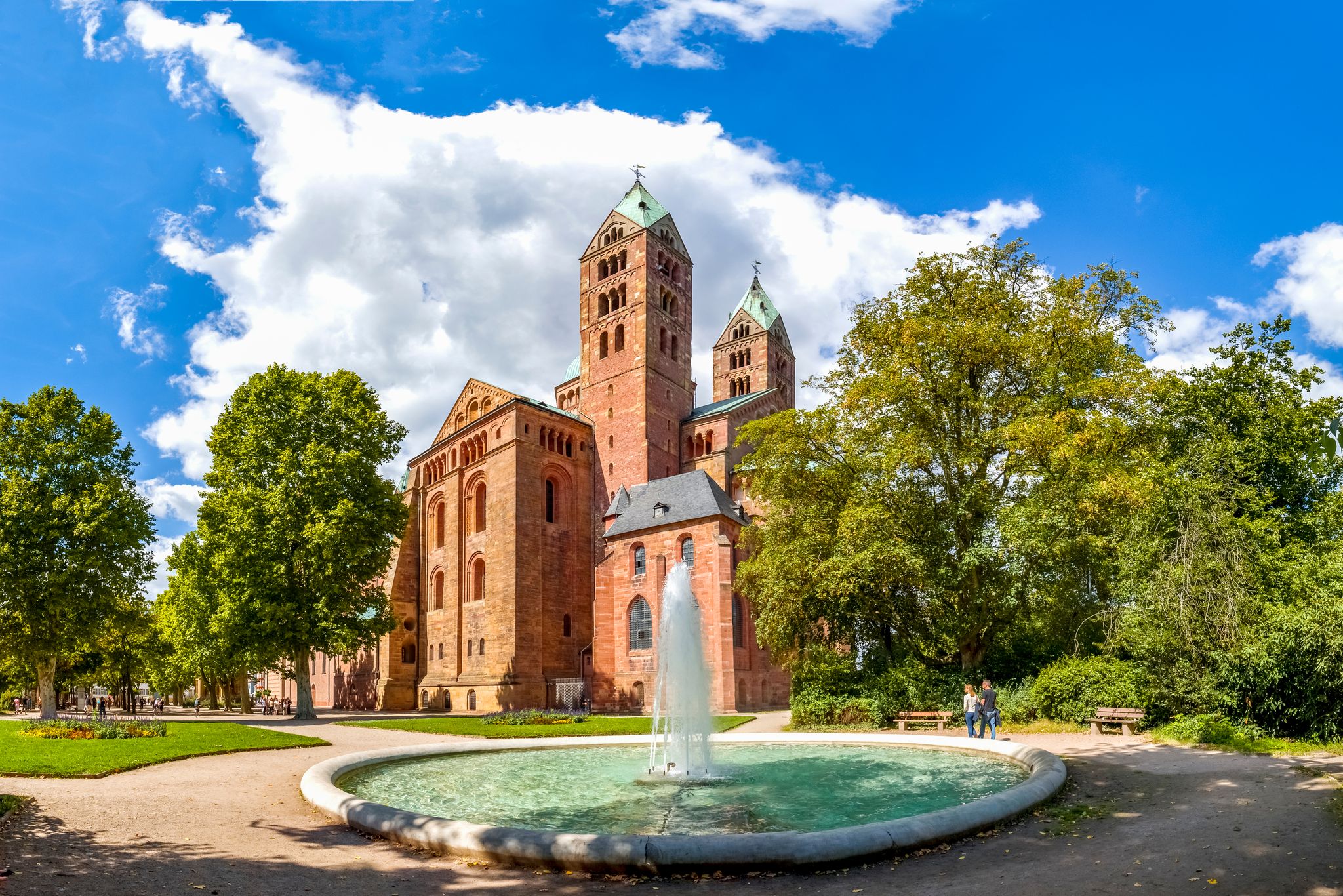 Photo of the famous cathedral of Speyer, Germany and a fountain in the adjacent park.