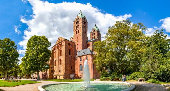 Photo of the famous cathedral of Speyer, Germany and a fountain in the adjacent park.