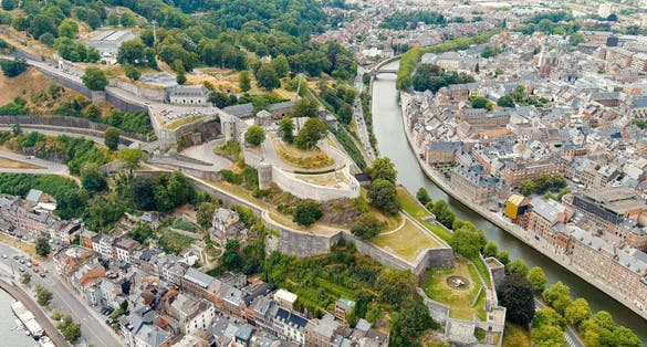 photo  of view of Namur, Belgium. Citadelle de Namur - 10th-century fortress with a park, rebuilt several times. Panorama of the central part of the city. River Meuse. Summer day, Aerial View