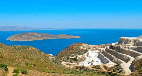 Photo of landscape and seascape of Crete island with a view of gypsum quarry. Open quarry is located at Altsi in Sitia.