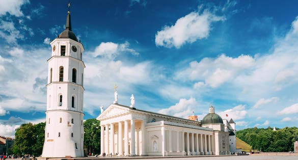 photo of vilnius, lithuania. View of bell tower and facade of cathedral basilica of st. Stanislaus and St. Vladislav on cathedral square, Famous landmark, Showplace In sunny summer under blue sky with clouds.