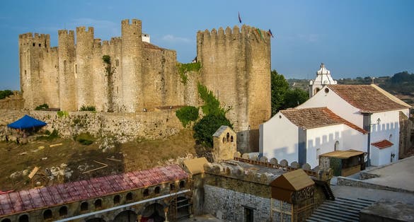 Photo of City landscape with medieval castle in Ã?bidos in Portugal.