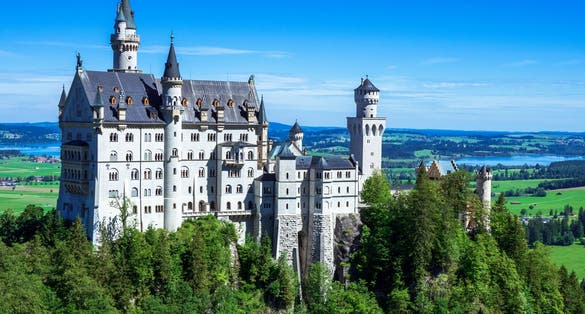 photo  of view of View of famous and amazing Neuschwanstein Castle, Füssen, Bavaria, Germany, seen from the Marienbrücke (Mary's Bridge), a pedestrian bridge built over a cliff