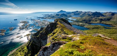 Photo of houses, bridge and panorama of Norwegian city Tromso beyond the Arctic circle from mountain in Norwegian fjords.
