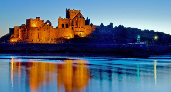 Peel Castle floodlit on the west coast of the Isle of Man.