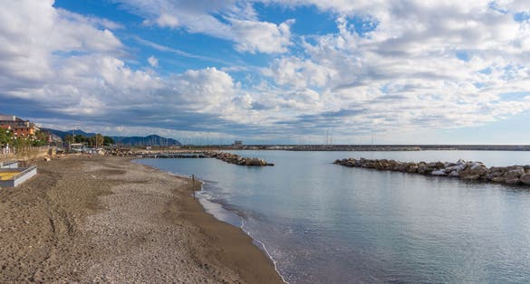view of the barrier of the beach, and panorama of Tigullio coast, Chiavari, Italy