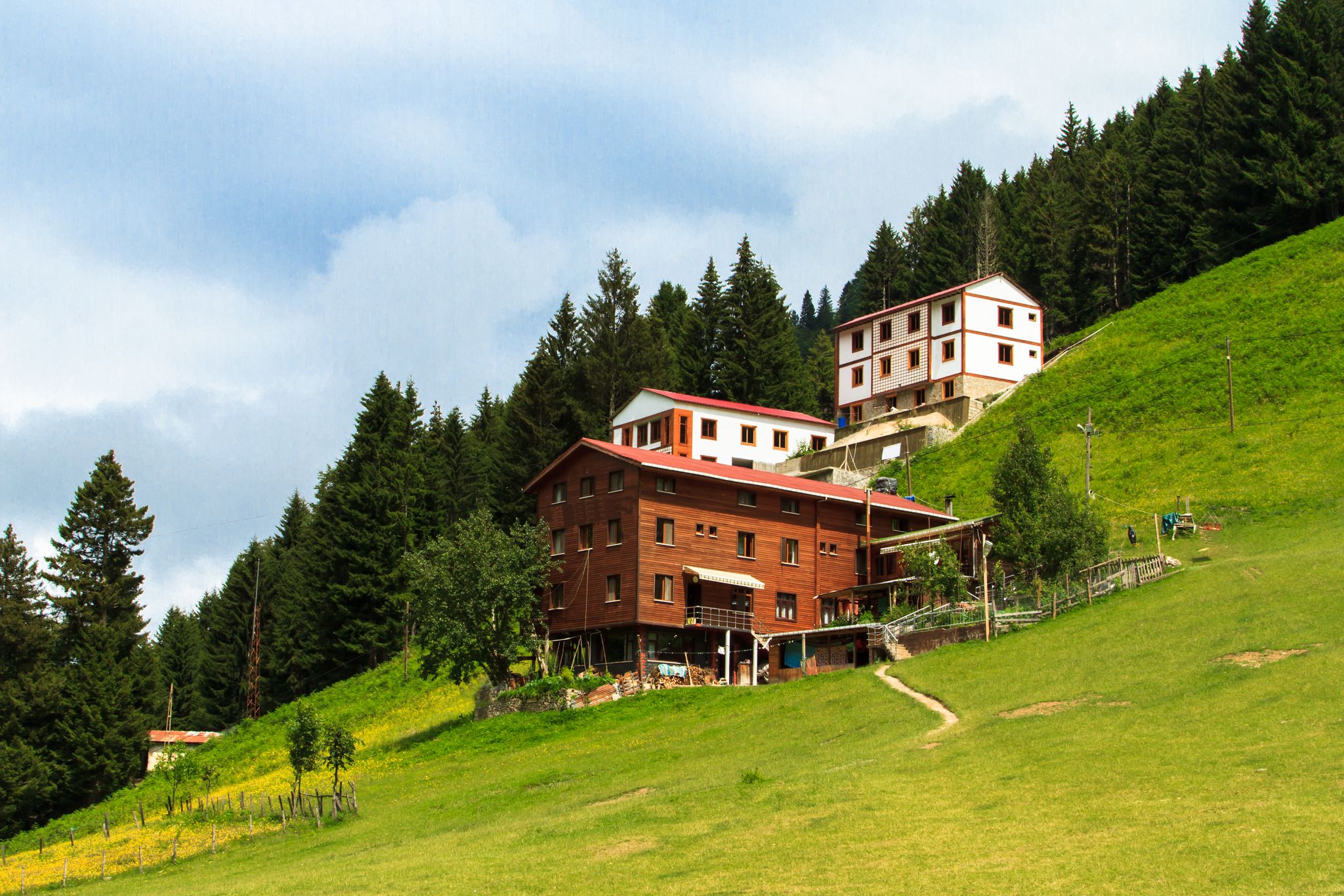 Photo of mountain houses with beautiful sky in Ayder Plateau, Rize, Turkey.