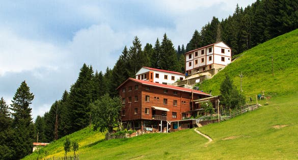Photo of mountain houses with beautiful sky in Ayder Plateau, Rize, Turkey.