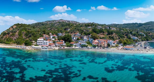 Photo of panoramic view of the idyllic fishing village Loutraki, port of Glossa, at the Sporades island Skopelos, Greece.