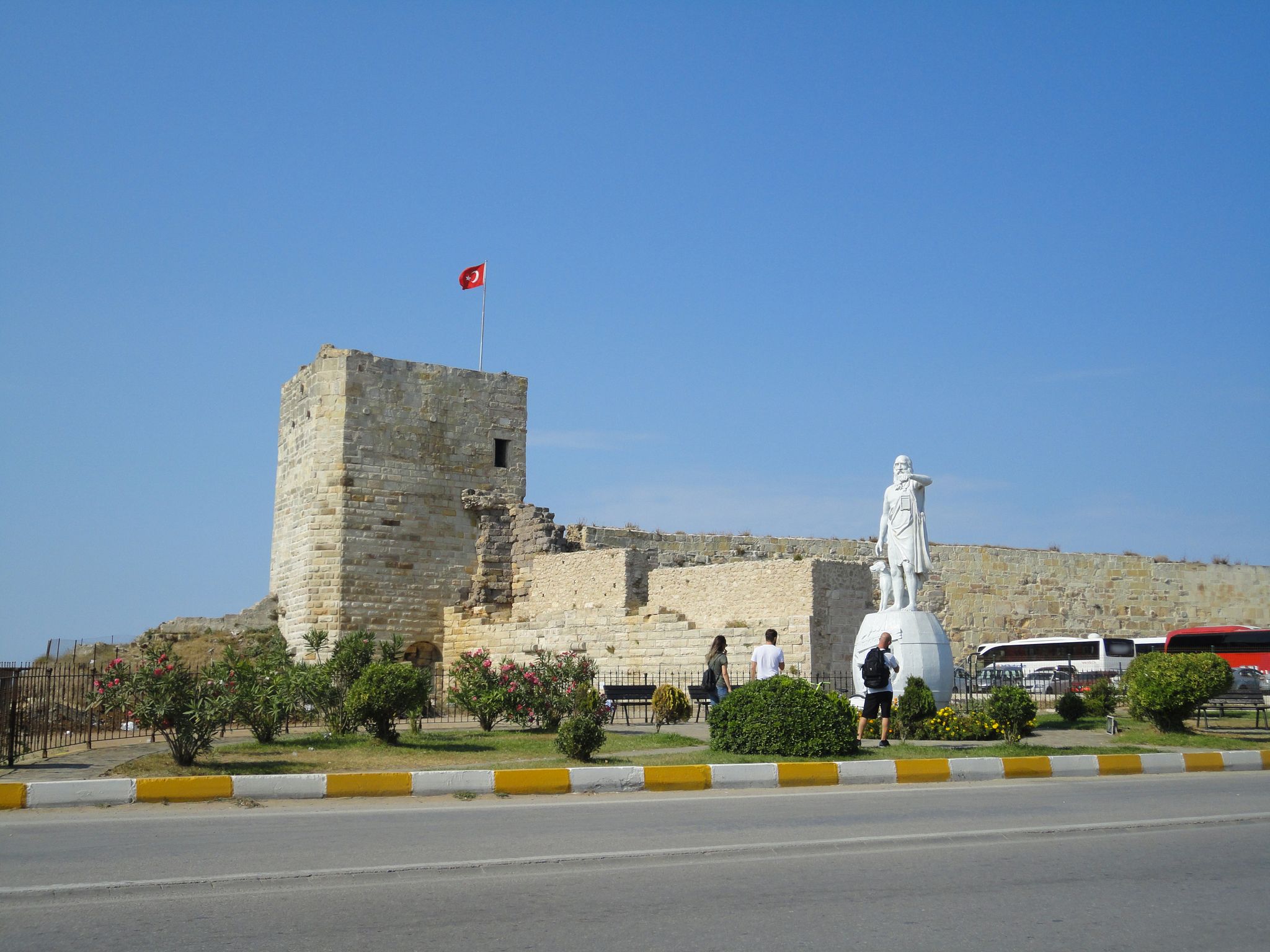 photo of Statue of Diogenes, famous ancient Greek philosopher born in Sinop in the 5th century BC. Sinop fortress in background in Turkey.