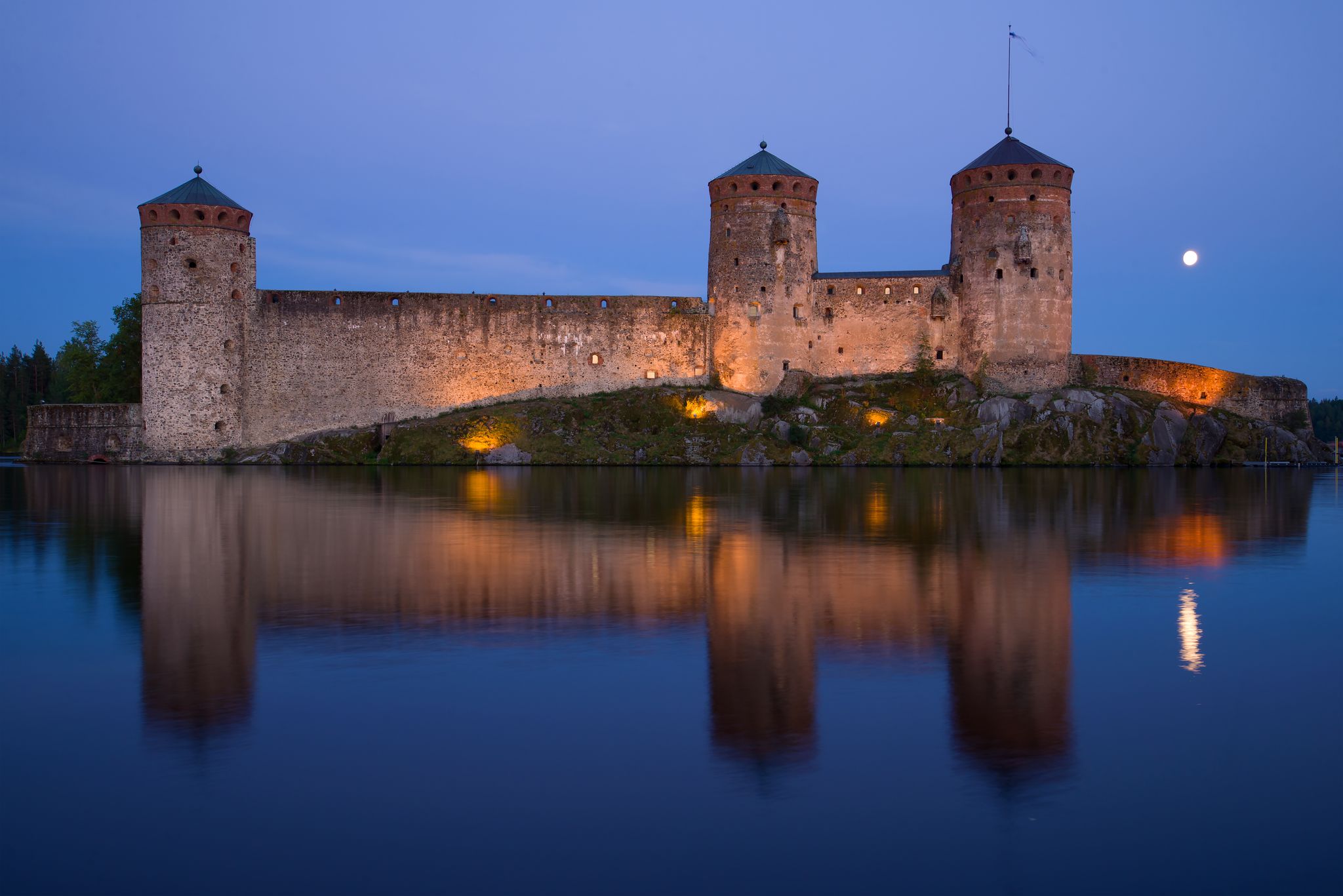 Photo of old fortress Olavinlinna close-up at night, Savonlina, Finland.