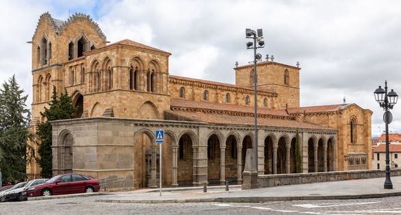 photo of view of Basilica of San Vicente in Avila, Spain, (The Basilica de los Santos Hermanos Martires, Vicente, Sabina y Cristeta), Romanesque architecture church building, exterior view.
