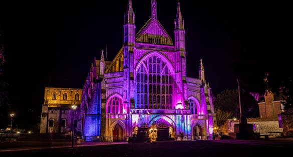 Photo of night view of Winchester Cathedral, Hampshire, during Christmas time, UK.