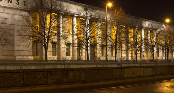 photo of "Haus der Kunst" museum in Munich, Germany, at night .