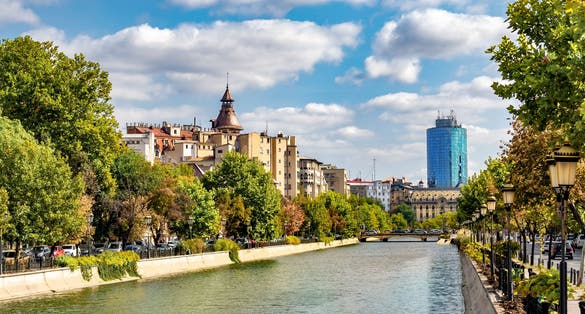 Cityscape view across Dambovita river city of Bucharest.