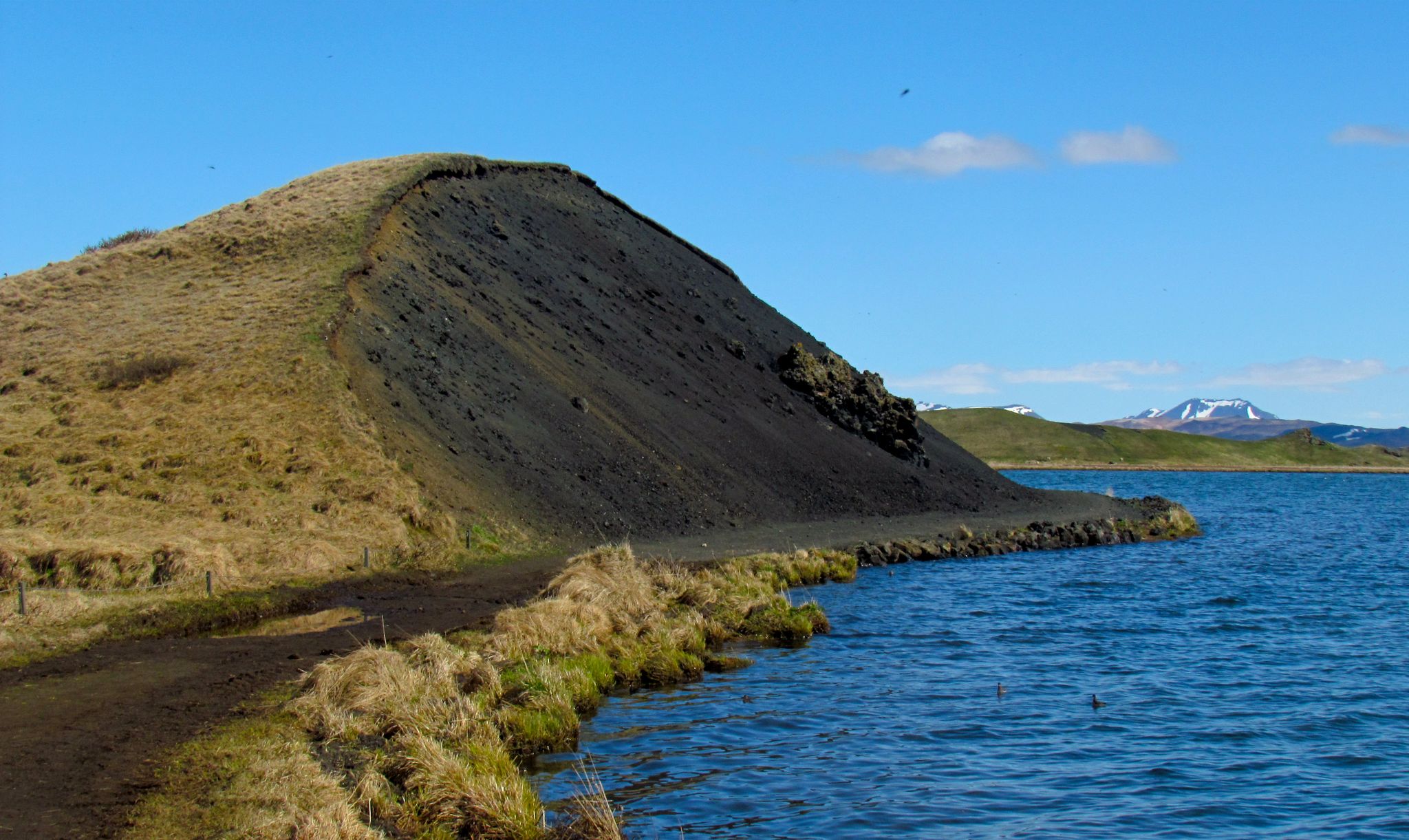 photo of view of Surreal landscape of the Lake Myvatn pseudocraters in Skútustaðir, Iceland.