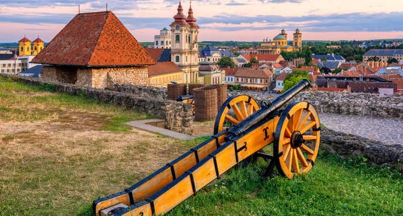 Photo of view over medieval Old town from the historical fortress on sunset, Eger, Hungary.