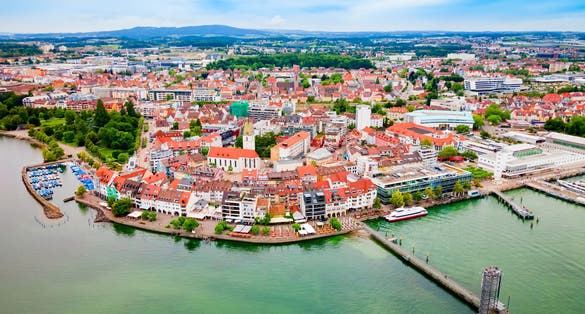 Photo of aerial panoramic view of Friedrichshafen that is a city on the shore of Lake Constance or Bodensee in Bavaria, Germany.