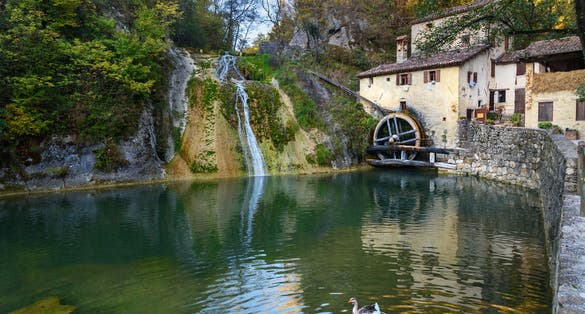 Ancient watermill wheel, Molinetto della Croda in Lierza valley. Refrontolo. Province of Treviso. Italy