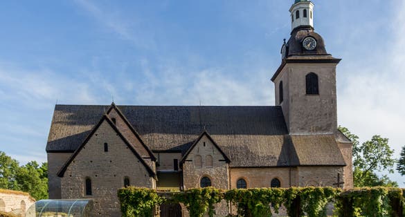 photo of Vreta Klosters Kyrka middle ages church with nice blue sky at Linkoping city, Sweden.