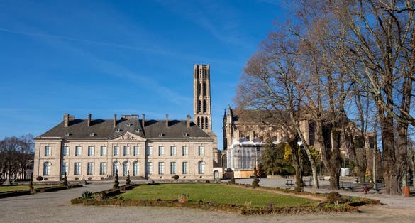 Photo of View on the Limoges Cathedral (French: Cathédrale Saint-Étienne de Limoges), a Roman Catholic church. Birght day and blue sky. Winter.
