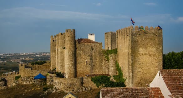 Photo of City landscape with medieval castle in Ã?bidos in Portugal.