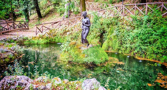 Fountain with female statue inside the Villa Vecchia, historic park of the city of Cosenza, Italy