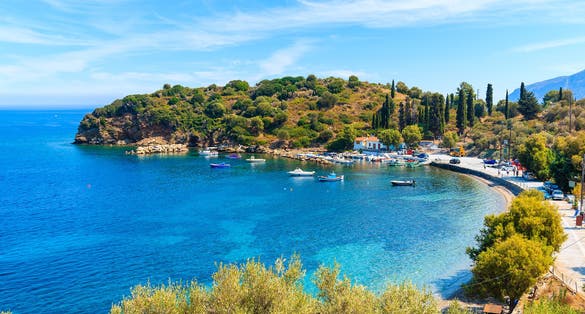 Photo of beautiful bay with fishing port on Samos island, Greece.