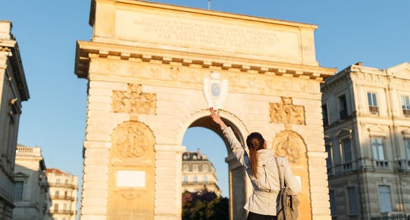 Photo of woman in historical city Montpellier in France, South Europe.