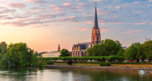 photo of view of Lutheran parish church Dreikonigskirche, Three Kings or Three Wise Men church, on the bank of Main river in Frankfurt am Main, Germany