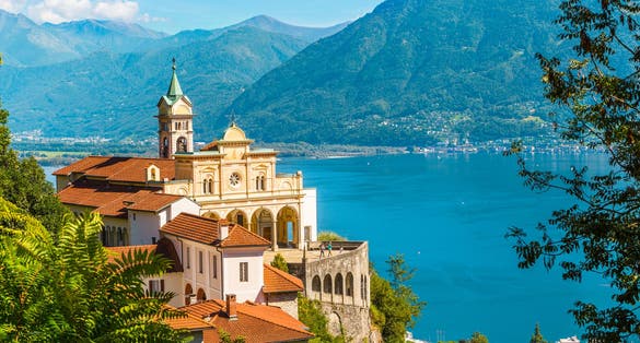 Photo of Madonna del Sasso Church above Locarno city and the Maggiore lake in Ticino, Switzerland.